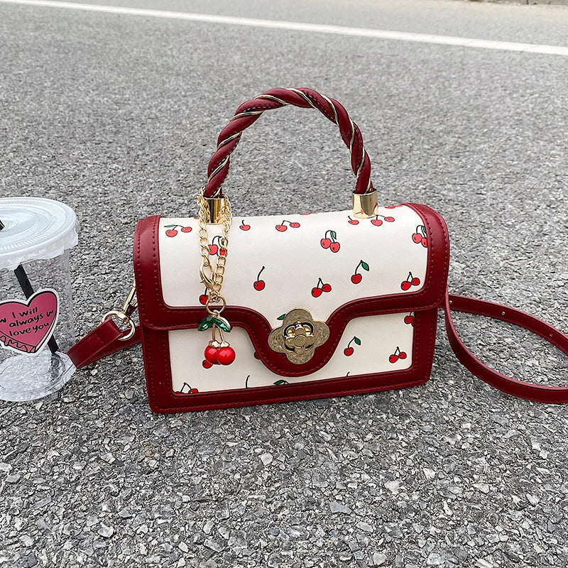 This Is a Red Handbag with a Cute Cherry Design for Dating and Shopping.