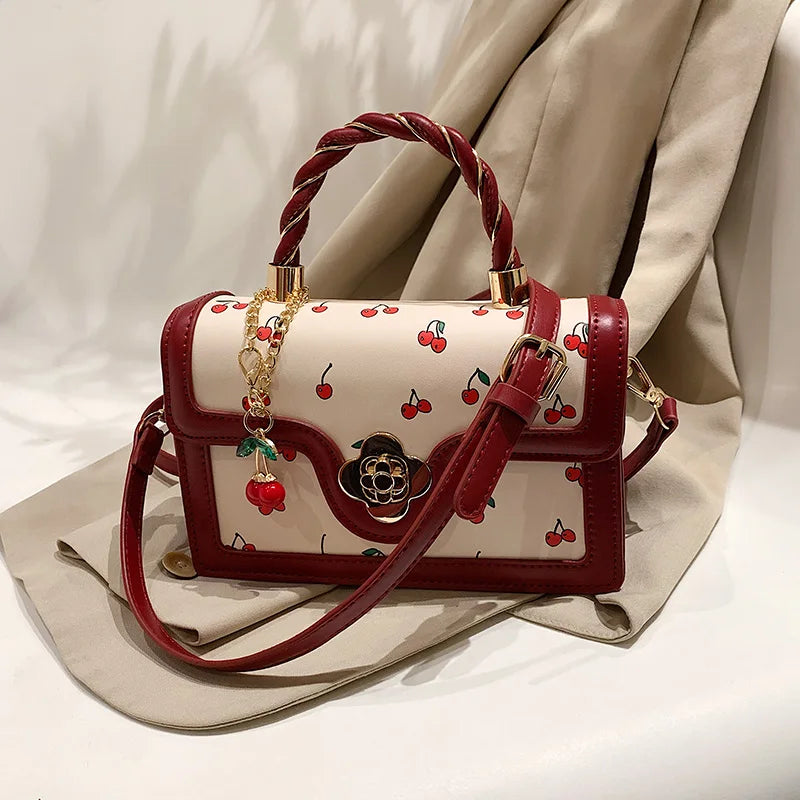 This Is a Red Handbag with a Cute Cherry Design for Dating and Shopping.