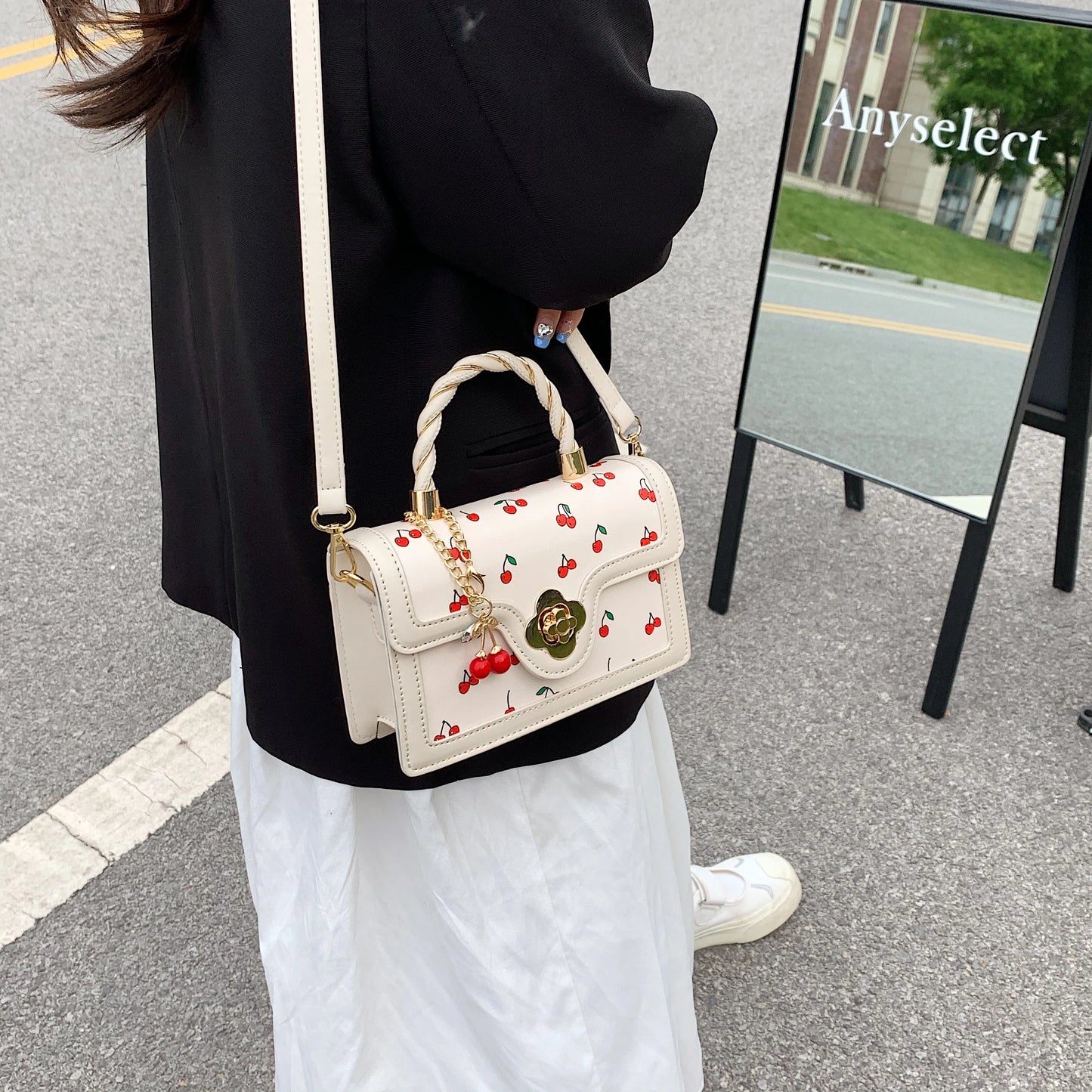 This Is a Red Handbag with a Cute Cherry Design for Dating and Shopping.